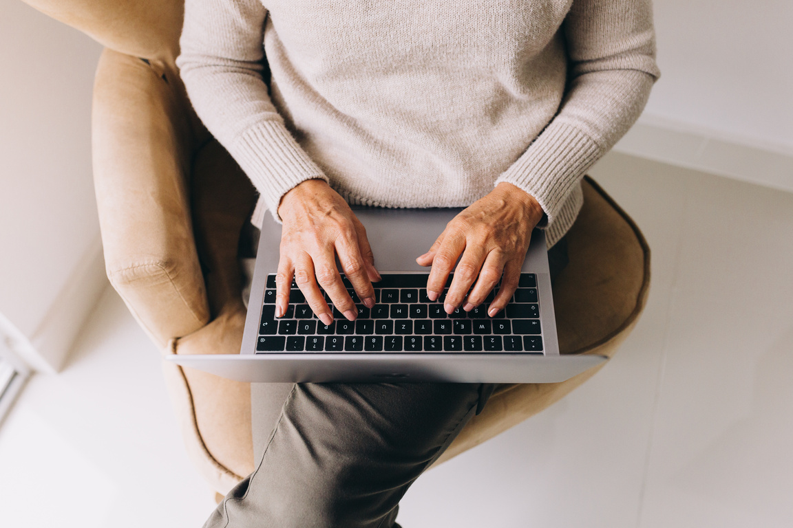 Woman Using Laptop at Home