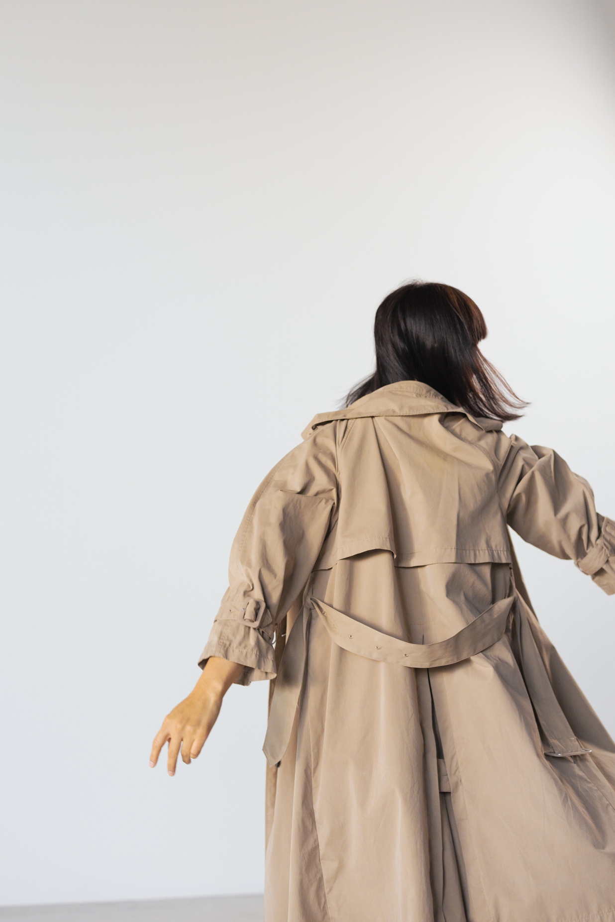 Back View of Person Wearing Brown Trench Coat